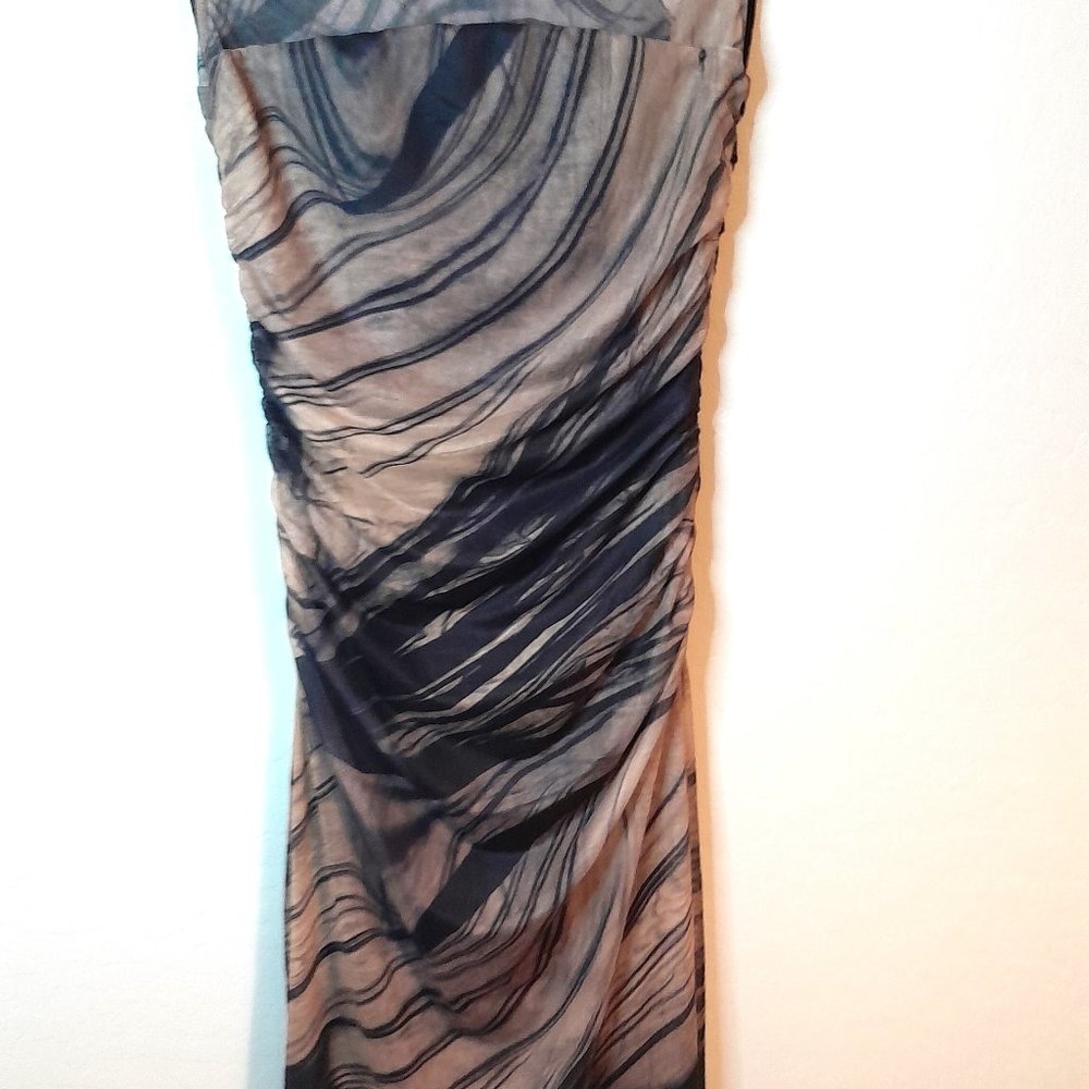 Commense Sleeveless high collar midi dress.
